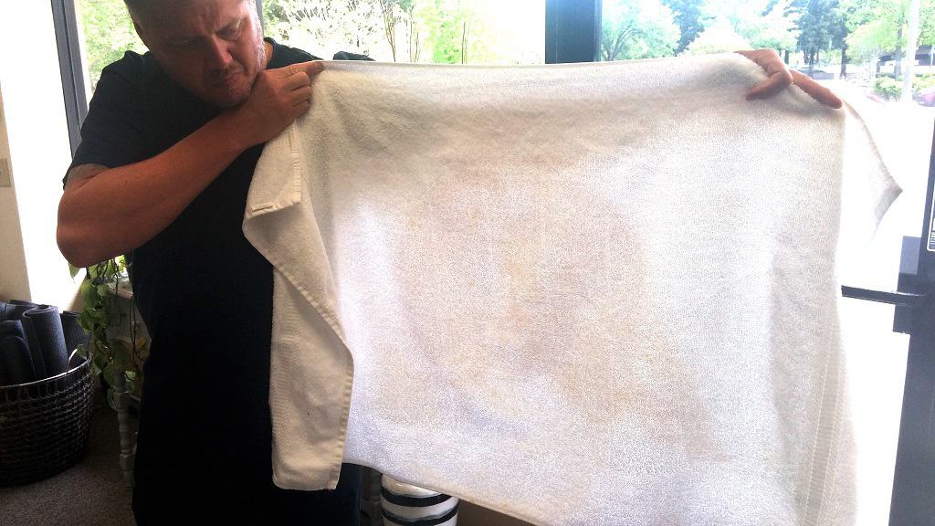 Detective LeBeau holding stained towel